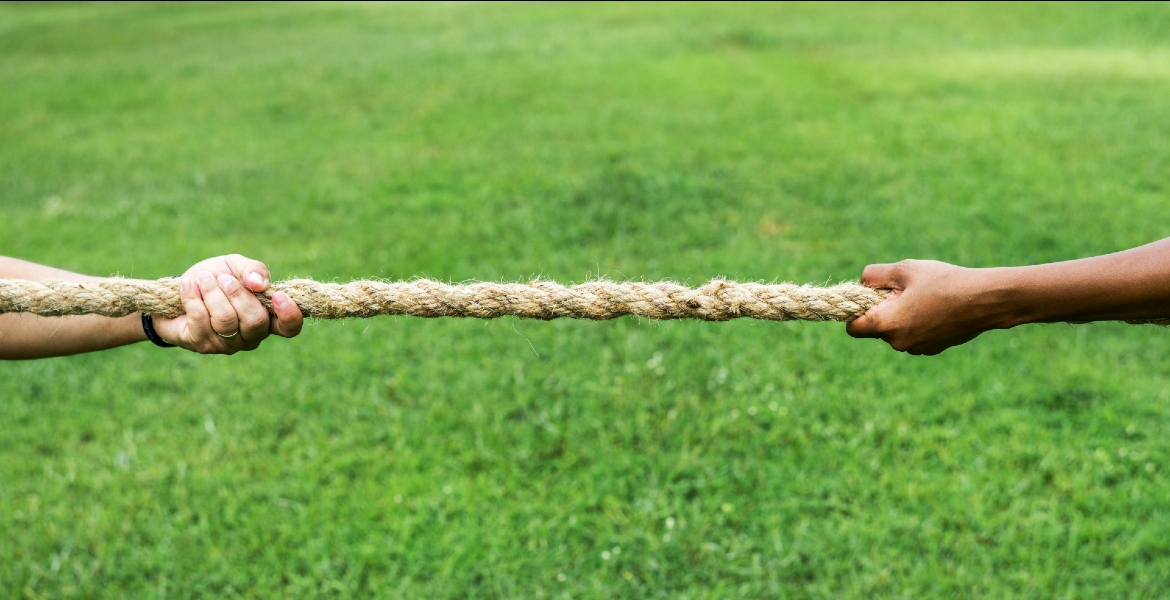 Photo of a tug-of-war between two people
