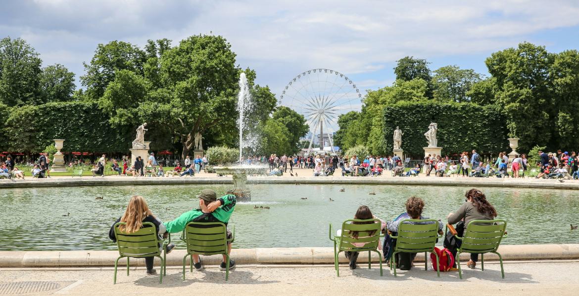 Photograph of people sitting in the Tuileries Gardens in Paris