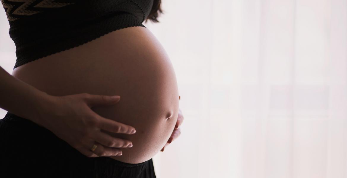 Photograph of a pregnant woman's belly