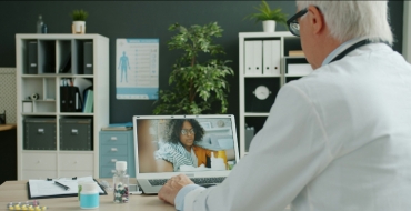 Photograph of a doctor during a teleconsultation