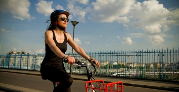 Photograph of a girl on a bicycle in Paris
