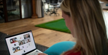Photograph of a girl working from home on her computer