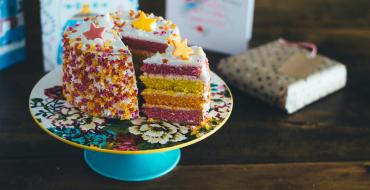Photograph of a cake with a cut-out slice