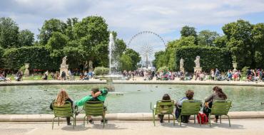 Photograph of people sitting in the Tuileries Gardens in Paris