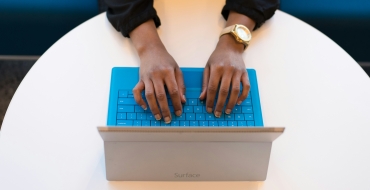 Photograph of a computer open on the Benefiz website